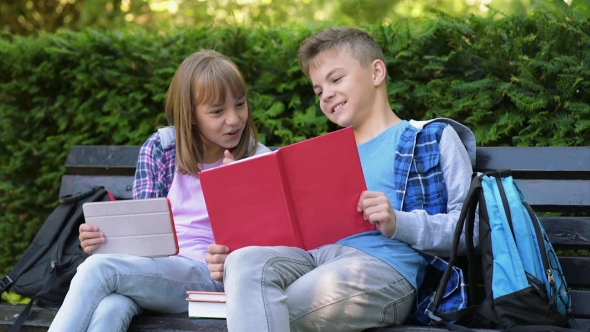 Boy And Girl Reading Book