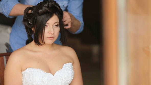 Hairdresser Stylist Fixing Fancy Bride's Hairstyle In Preparations At Morning Of Wedding Day