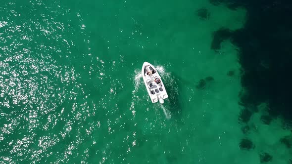 Bird'seye View of a Tourist Boat Sailing on the Sea on a Sunny Summer Day alt