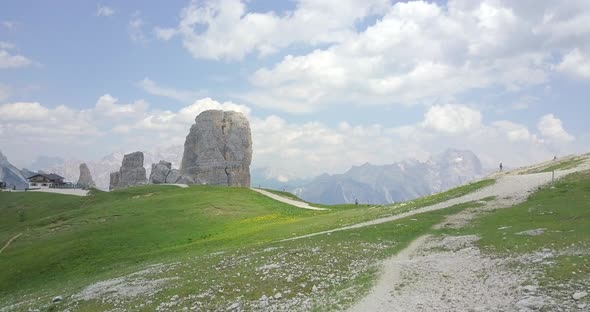 Aerial drone view of a group of people hiking in the mountains alt