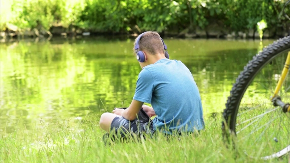 Teen Boy At Lakeside