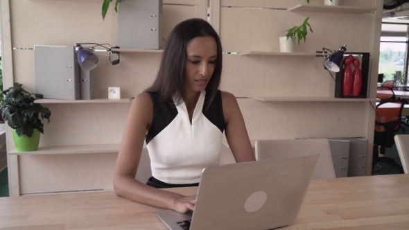 Happy Woman Finished Work Day Looking To The Camera With Friendly Smile. alt
