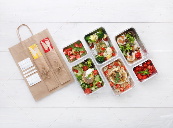 Healthy food take away in boxes, top view at wood - Stock Photo - Images