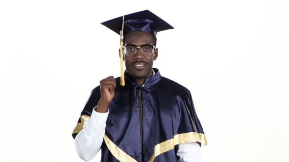 Black Man In Dressed For Graduation. White.  alt