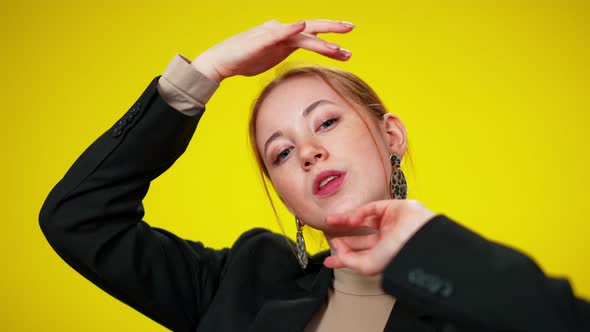 Closeup of Charming Smiling Young Redhead Woman Looking at Camera Touching Head alt