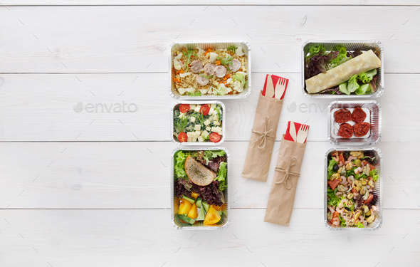 Healthy food take away in boxes, top view at wood - Stock Photo - Images