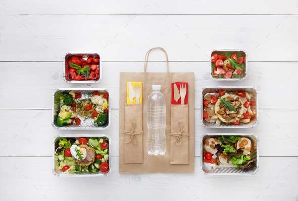 Healthy food take away in boxes, top view at wood - Stock Photo - Images