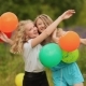 Two Girlfriends Best Friends Hugging With Colorful Balls. - VideoHive Item for Sale