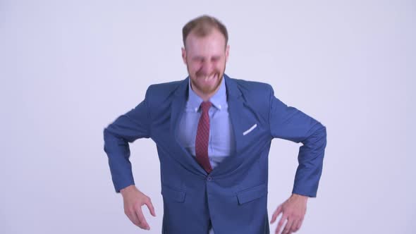Happy Bearded Businessman Laughing at Camera