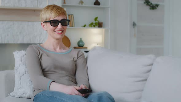 Young Attractive Woman Wearing 3d Glasses Holding Remote Control Watching Funny Television Show alt