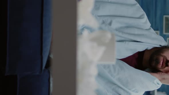 Vertical Video Close Up of Man with Headache Holding Head and Feeling alt