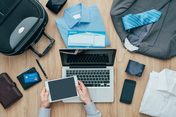 Businessman planning a business trip - Stock Photo - Images