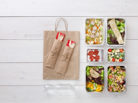 Healthy food take away in boxes, top view at wood - Stock Photo - Images