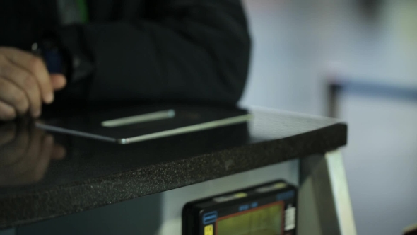 The Woman Working in Airport is Giving Necessary Documents to Man