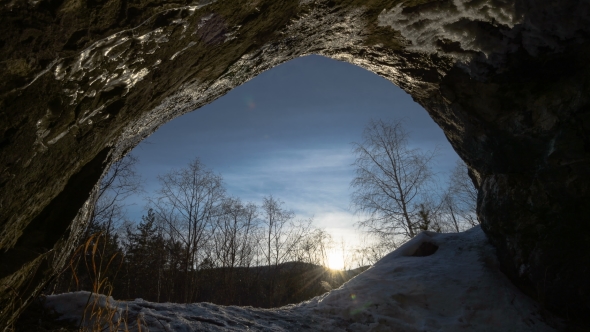 Sunset In The Winter Forest Cave.