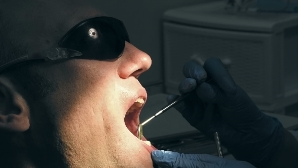 Man Gets Dentist Medical Mouth Teeth Examination
