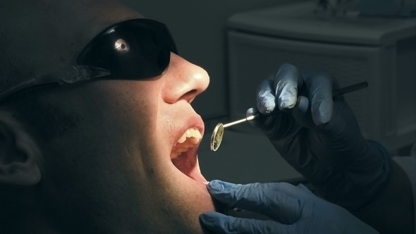 Middle Aged Man Gets Dental Mouth Teeth Treatment