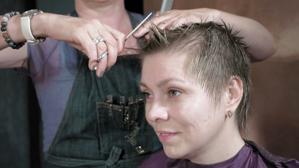 Hairdresser Cuts Combs And Styles Woman's Hair