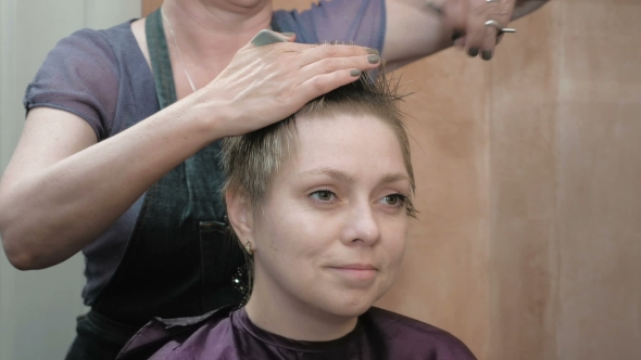 Hairdresser Cuts Combs And Styles Woman's Hair