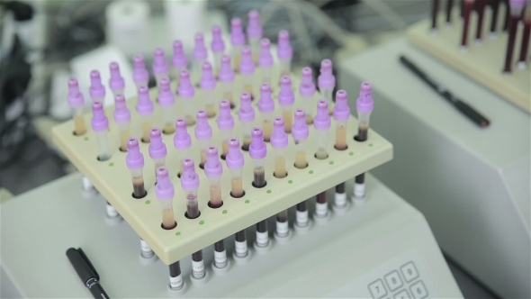 Modern Medical Automated Machine Examine Test Tube With Blood Samples In Medical Laboratory. alt