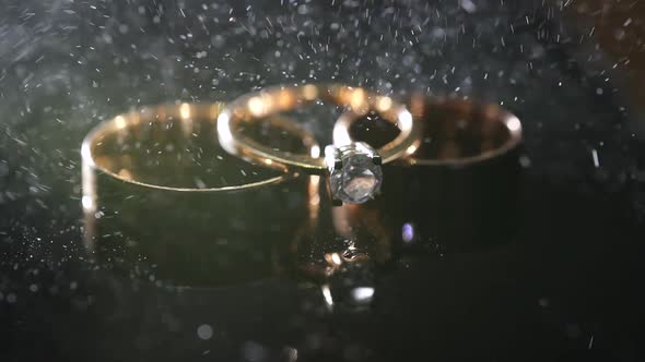 Wedding Rings Sprinkled with Perfume. Macro.
