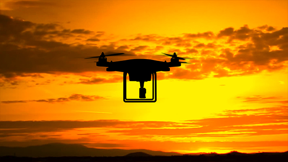 Quadcopter Drone Silhouette At Sunset