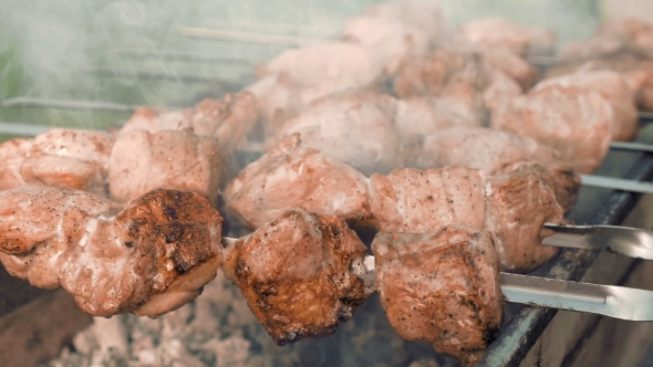 Barbecue Skewers With Meat Cooking On The Grill