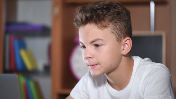 Teen Boy Working On Laptop