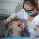 Dental Surgeon Applies Dental Probe To Examine Patient's Teeth - VideoHive Item for Sale