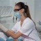 Female Dentist Begins The Checkup Of Her Patient At The Dentist Cabinet - VideoHive Item for Sale