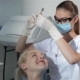 Female Dentist Uses Dental Tool To Check Patient's Teeth - VideoHive Item for Sale