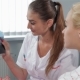 Female Dentist Explains Something To Her Patient At The Dentist Cabinet - VideoHive Item for Sale