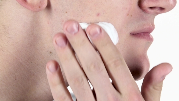 Man Put On Area Of Cheek Shaving Cream. White Background alt