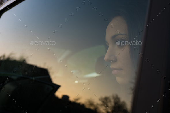 Girl sitting in a car - Stock Photo - Images