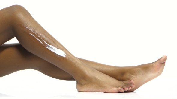 Woman Shaving Leg. White.  alt