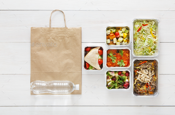 Healthy food take away in boxes, top view at wood - Stock Photo - Images