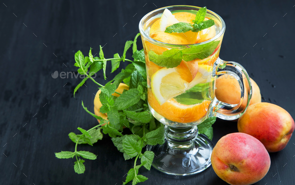 Fresh water with fruits and mint leaves