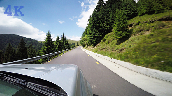 Driving Throug the Mountains alt