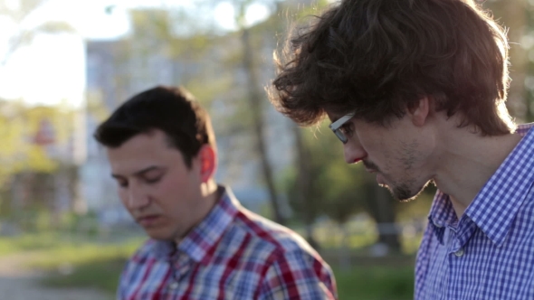 Outdoors Two Friends Using Laptops