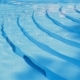 Long Shot Of Woman Lying On The Pool Edge - VideoHive Item for Sale