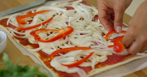 Woman Make a Tasty Traditional Homemade Pizza alt