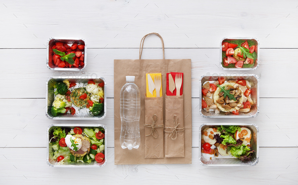Healthy food take away in boxes, top view at wood - Stock Photo - Images