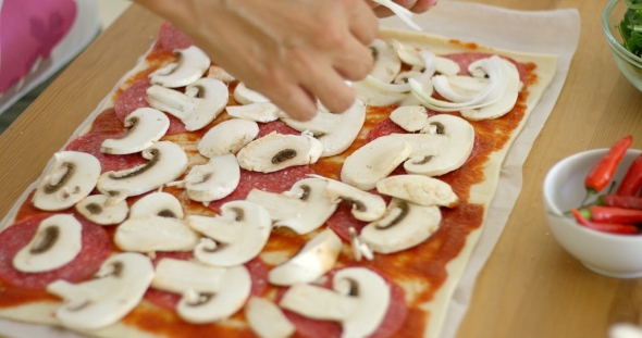Woman Making a Delicious Pepperoni Pizza alt