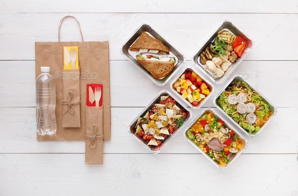 Healthy food take away in boxes, top view at wood - Stock Photo - Images