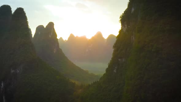 Aerial of the amazing rock formations along the Li River in China alt
