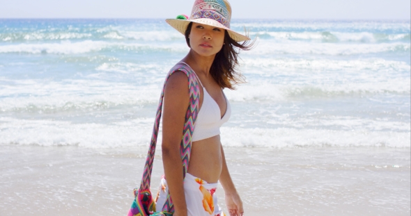 Sexy Young Woman Strolling On a Tropical Beach alt