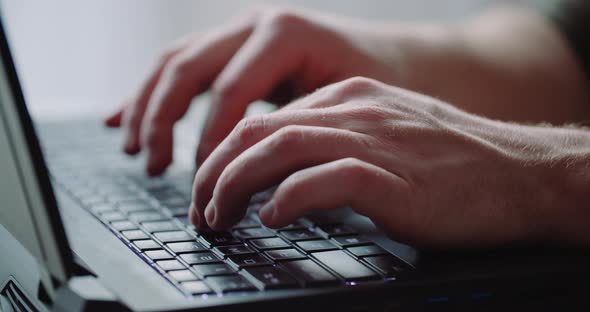 Business - Businessman Hands Type on Laptop Computer Close Up alt