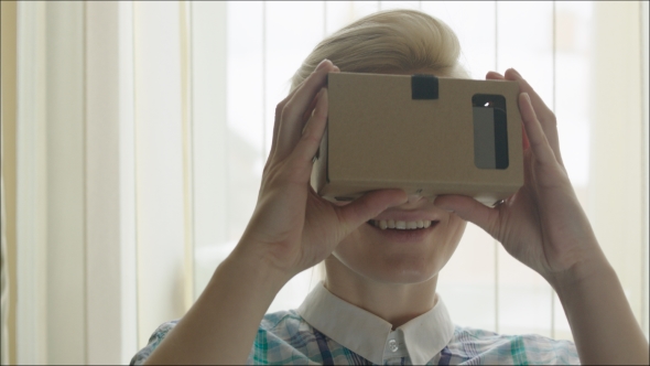 Smiling Woman Exploring Virtual Reality alt