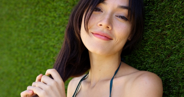 Pretty Woman Wearing Top With Green Strap alt