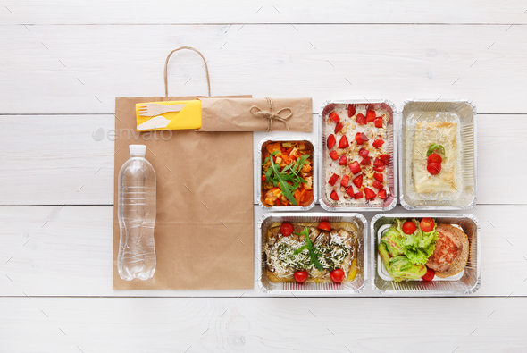 Healthy food take away in boxes, top view at wood - Stock Photo - Images